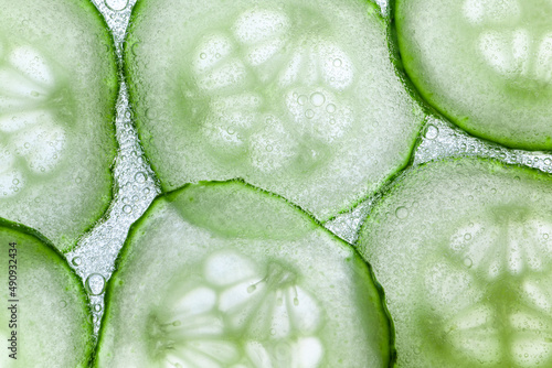 Фотография Cucumber slices cosmetic with sparking water or gel