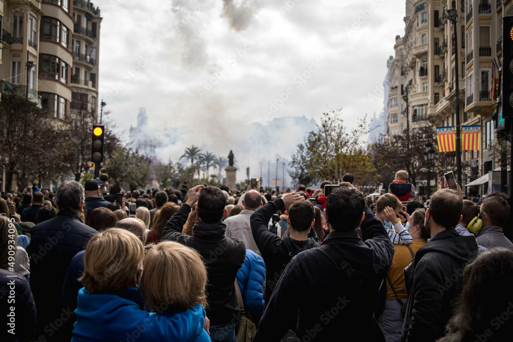 Multitude of People Attentively Observing the Explosion of Firecrackers of the Mascleta de Valencia in Fallas from the Town Hall Square