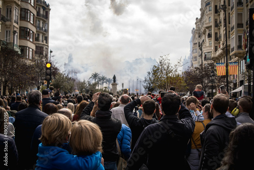 Multitude of People Attentively Observing the Explosion of Firecrackers of the Mascleta de Valencia in Fallas from the Town Hall Square