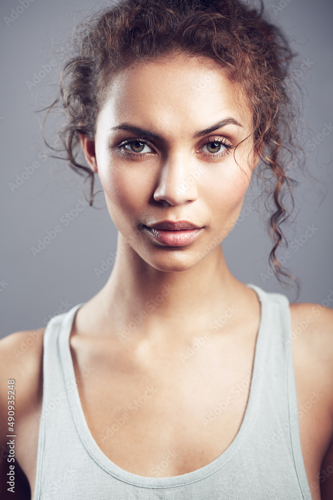 Gorgeous in all the right ways. Studio shot of a gorgeous young woman posing against a gray background. Gorgeous in all the right ways. Studio shot of a gorgeous young woman posing against a gray background.