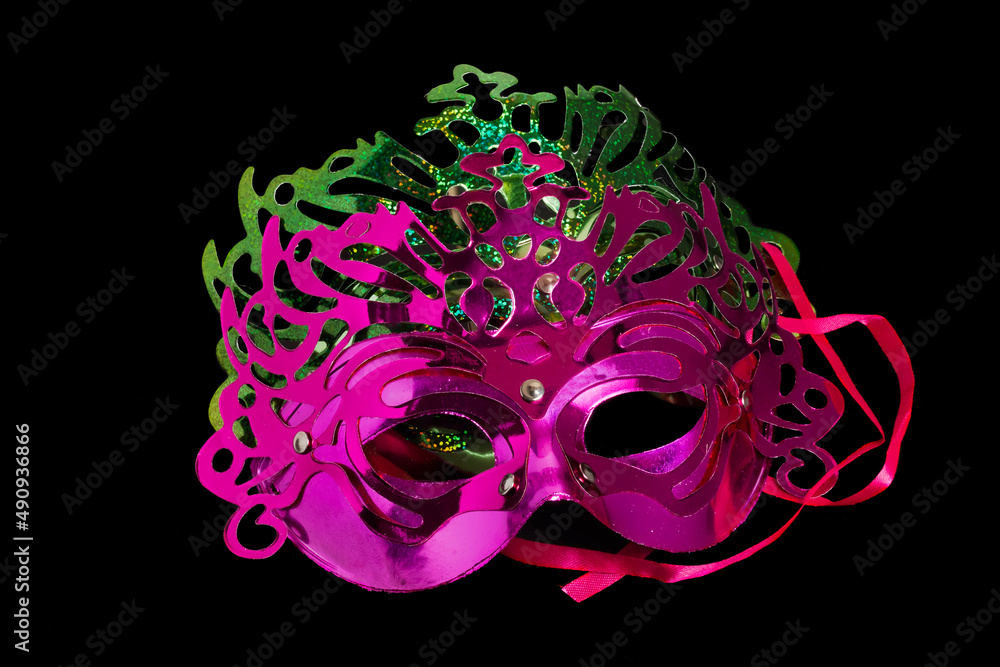 Multicolored carnival mask on black background.