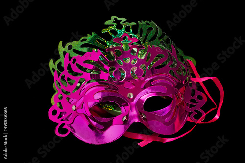 Multicolored carnival mask on black background.