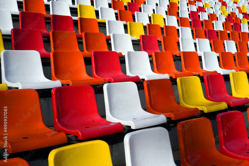 Fototapeta premium Rows of empty colorful plastic seats in a stadium. Beautiful! 