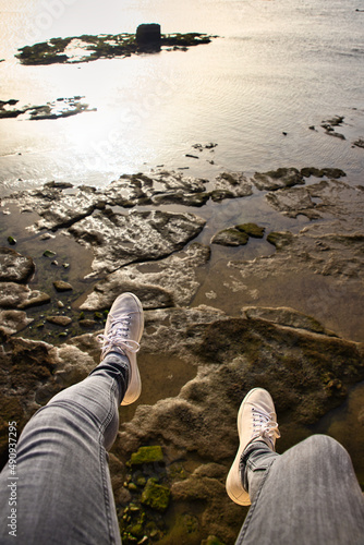 pov of a person on a cliff with the sea below