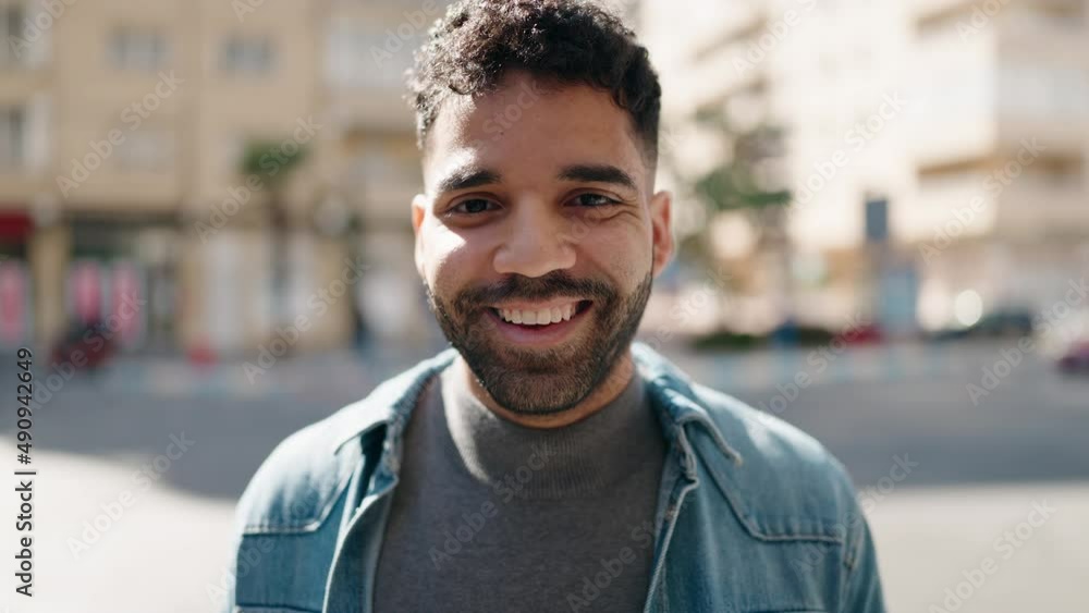 Young arab man smiling confident standing at street Young arab man smiling confident standing at street