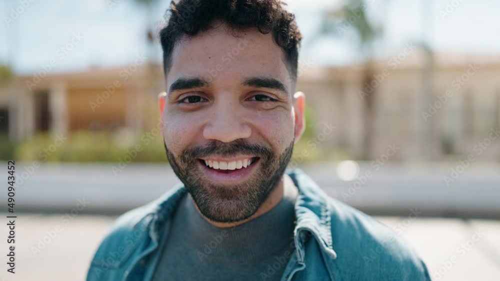 Young arab man smiling confident standing at street Young arab man smiling confident standing at street