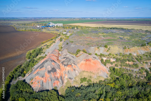 Fotografie A coal landfill next to the mine surrounded by agricultural land
