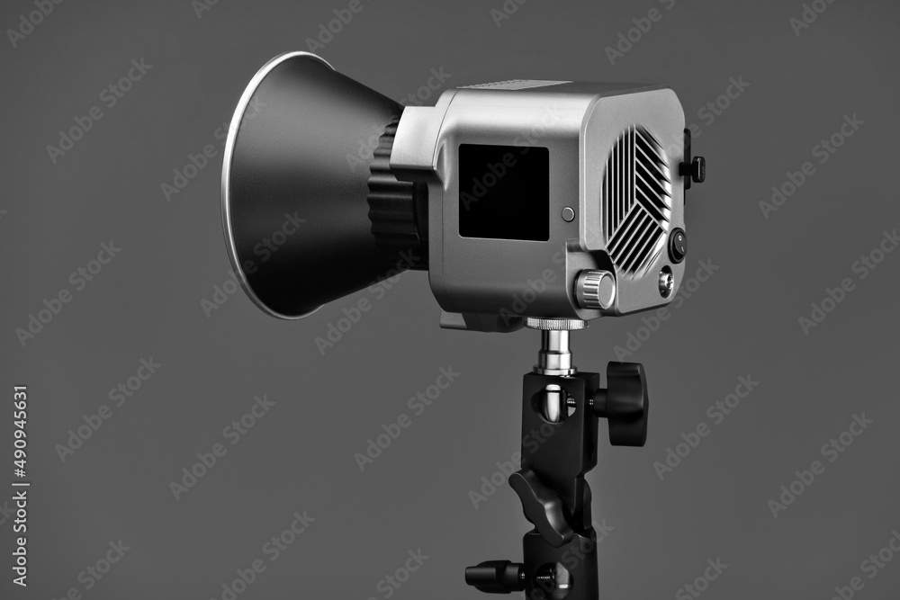 Close-up of a professional studio light on a gray background.Close-up of a professional studio light on a gray background. Close-up of a professional studio light on a gray background.Close-up of a professional studio light on a gray background.