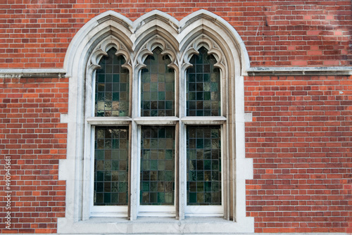 Beautiful window in gothic style. Three arches. London city
