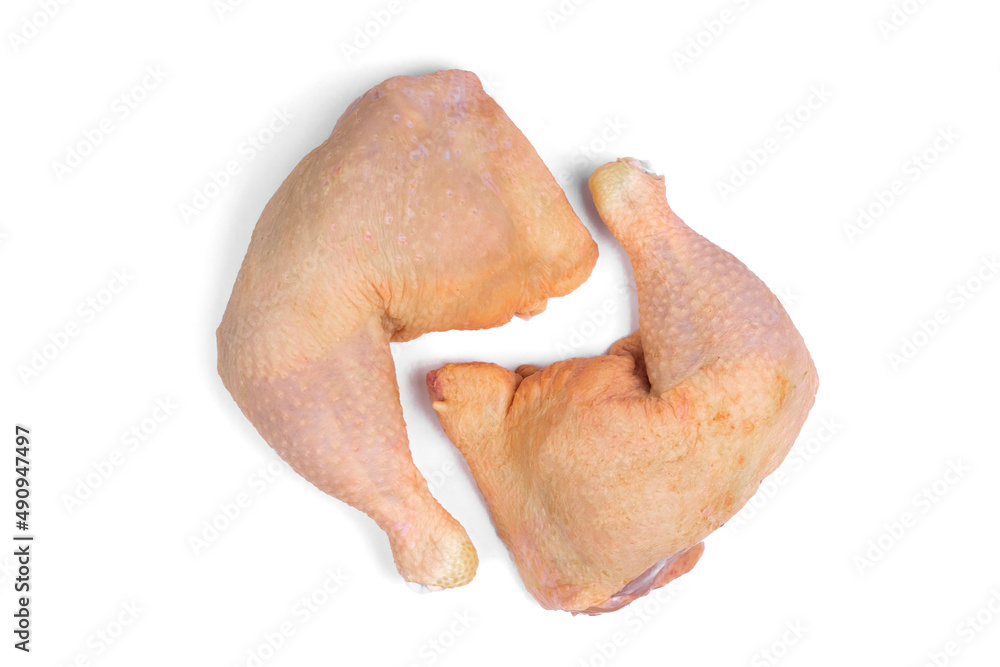 Raw chicken leg quarters on white isolated background. Stock Photo