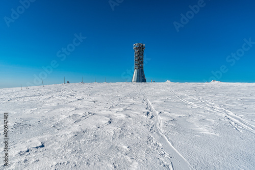Kralicky Sneznik hill summit on czech - polish borders during winter day with clear sky photo