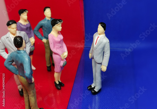 Danish politics symbolised by figurines debating in a blue and a red area where the politicians confront each other photo