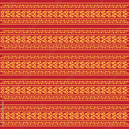 traditional pattern aceh indonesia with gold color and red maroon background photo