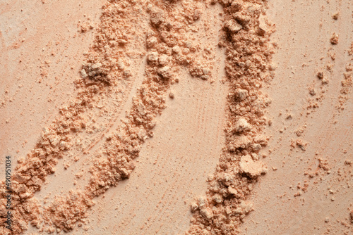 Bronzer or compact powder beige nude textured background