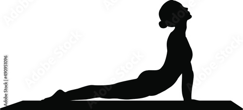 Black silhouette of a girl doing yoga on a mat