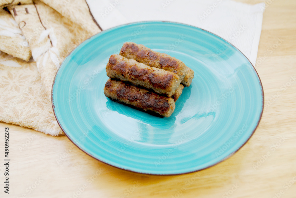 Cooked Breakfast Sausage Links Served on a Plate	
