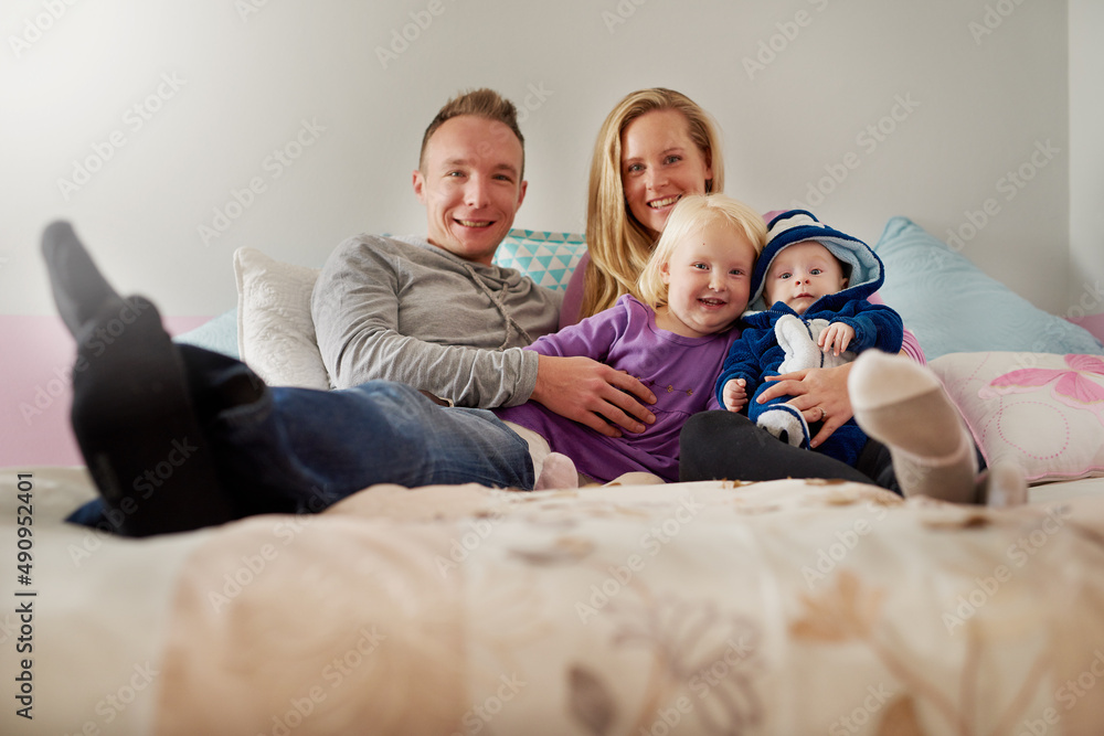 Family is the greatest blessing you can ever have. Portrait of a happy family spending quality time together at home. Family is the greatest blessing you can ever have. Portrait of a happy family spending quality time together at home.
