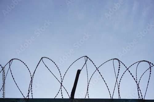 barbed wire close-up, blue sky