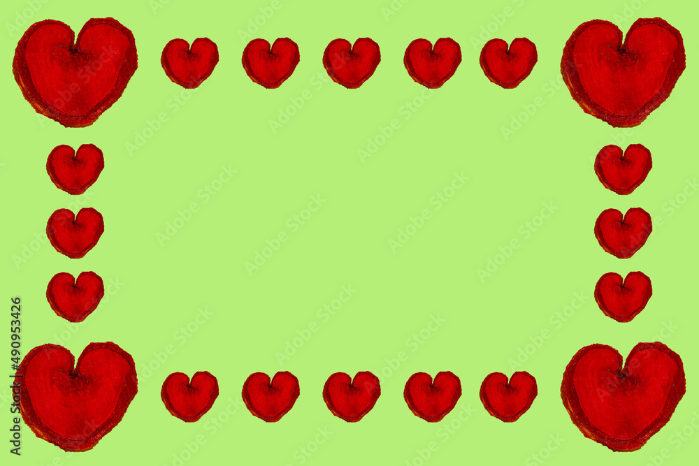 red wooden hearts on the edges of the paper lovingly natural design in pastel green