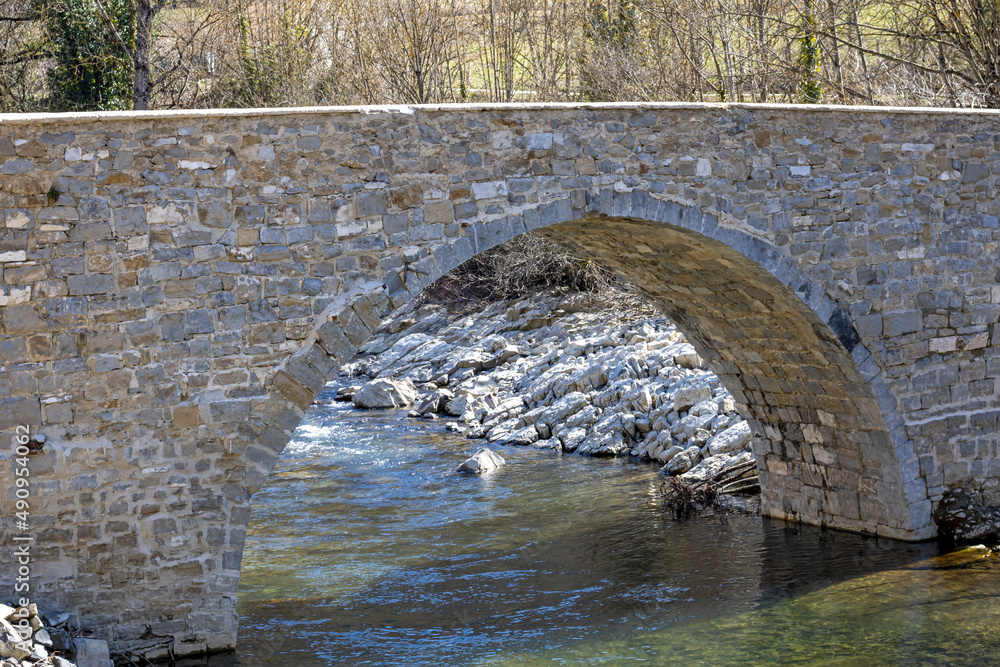 Ancient stone bridge over a river