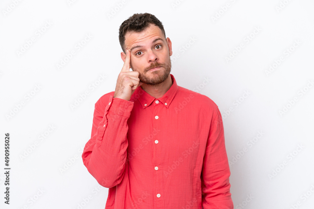 Young Brazilian man isolated on white background thinking an idea Young Brazilian man isolated on white background thinking an idea