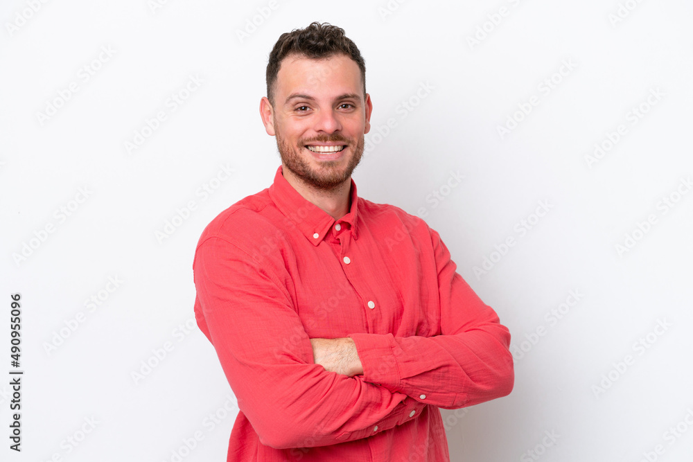 Young Brazilian man isolated on white background with arms crossed and looking forward Young Brazilian man isolated on white background with arms crossed and looking forward