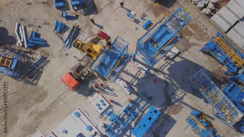 Modern industrial construction of a large industrial plant. View from the air. Construction crane, construction machinery.