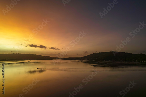 Hazy Sunrise Waterscape with Reflections