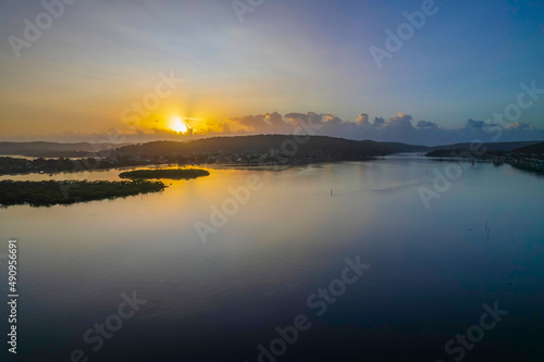 Hazy Sunrise Waterscape with Reflections