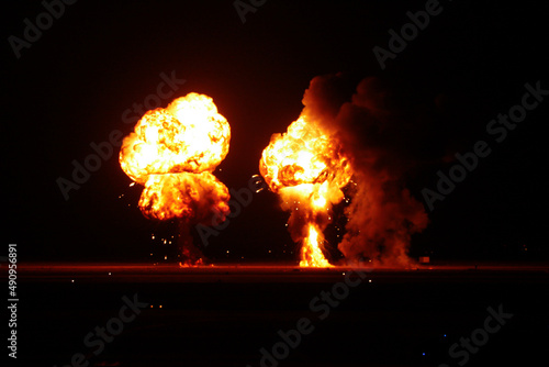 Huge bomb explosions at night during war