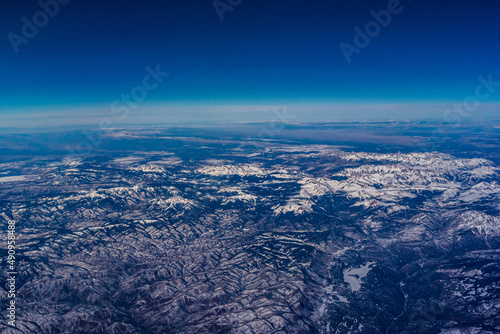 Aerial view of snow covered mountains © John McAdorey