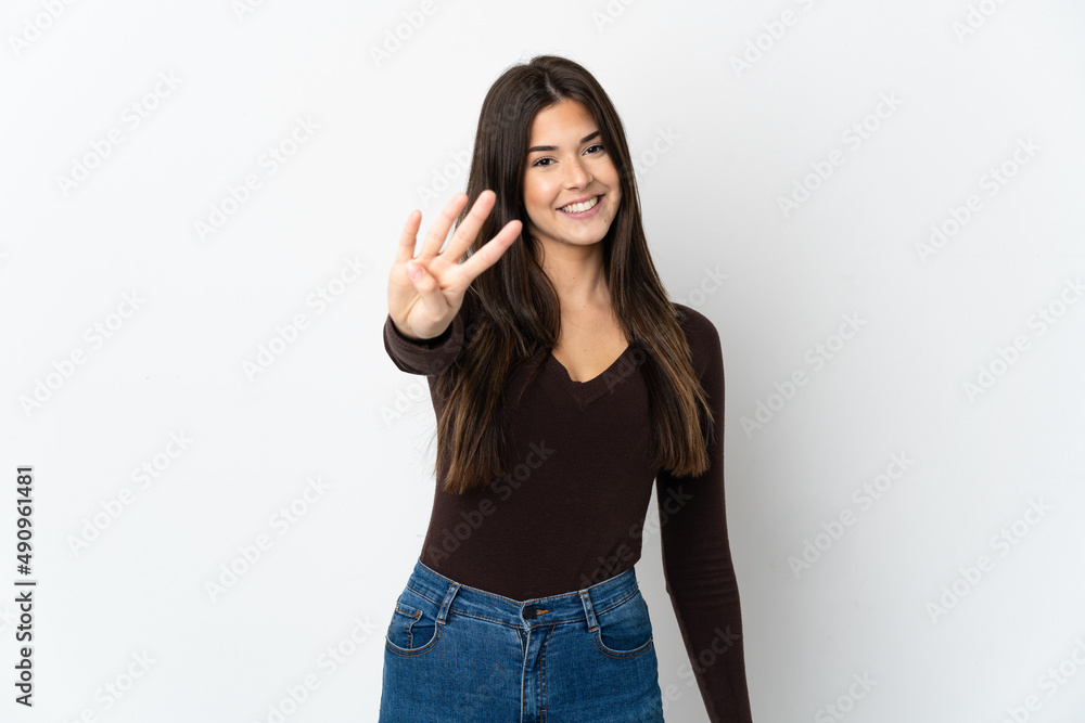 Teenager Brazilian girl isolated on white background happy and counting four with fingers Teenager Brazilian girl isolated on white background happy and counting four with fingers