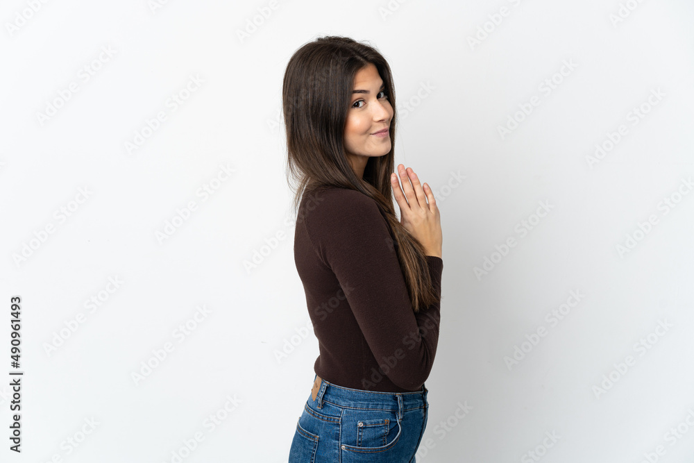 Teenager Brazilian girl isolated on white background scheming something Teenager Brazilian girl isolated on white background scheming something