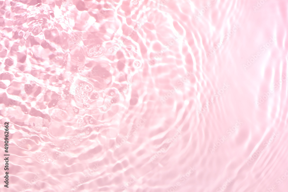 Cosmetic rose pink water gel splash with bubbles texture background