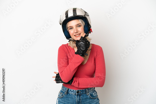 Young caucasian woman with a motorcycle helmet isolated on white background happy and smiling © luismolinero