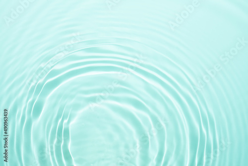 Cosmetic blue green water gel splash with bubbles texture background