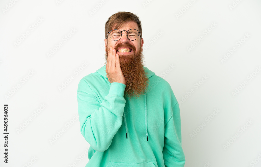 Young reddish caucasian man isolated on white background with toothache Young reddish caucasian man isolated on white background with toothache