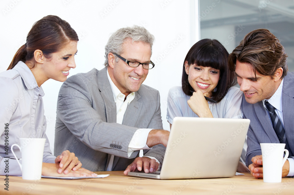 Our profit margins will go through the roof. A team of businesspeople working on a laptop together. Our profit margins will go through the roof. A team of businesspeople working on a laptop together.