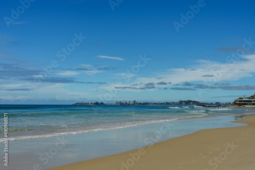 Fototapeta Naklejka Na Ścianę i Meble -  View to the south along the shoreline at Currumbin Beach, Gold Coast, Queensland, Australia. 