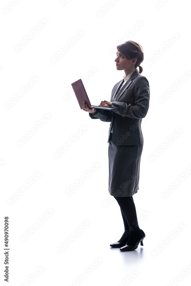 Silhouette of Caucasian woman using laptop PC. Silhouette of Caucasian woman using laptop PC.