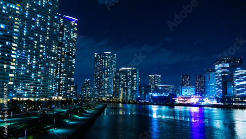 Night view of a high-rise condominium along an urban river_21