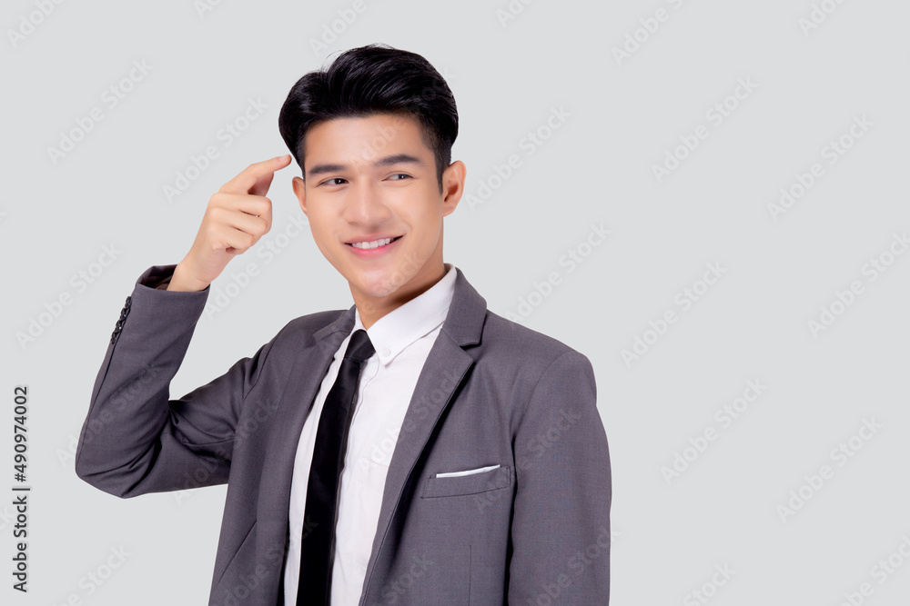 Portrait young asian business man in suit with smart thinking idea with intelligent isolated on white background, businessman standing and planning for success, manager or executive pointing head. Portrait young asian business man in suit with smart thinking idea with intelligent isolated on white background, businessman standing and planning for success, manager or executive pointing head.