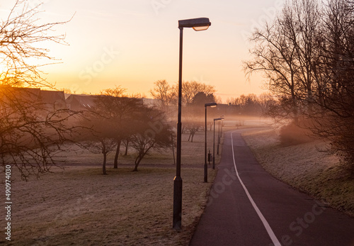 Bike lane through foggy landscape in Malmo, Sweden photo