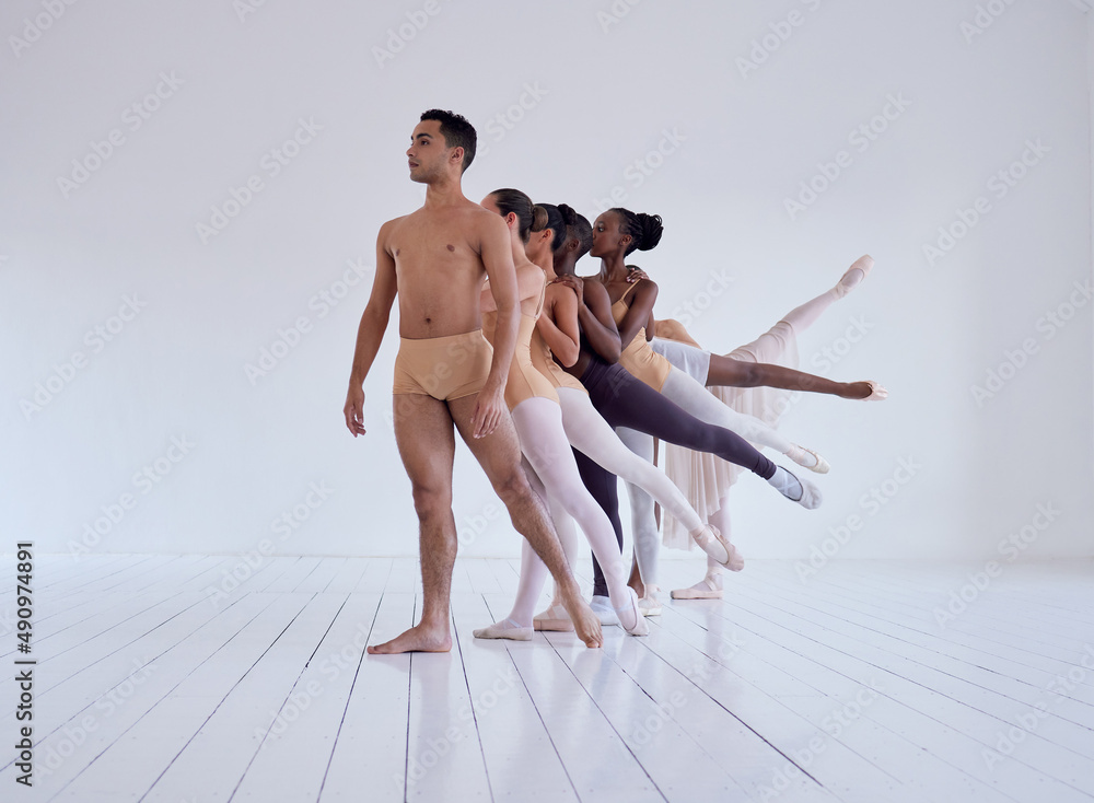 Obraz premium Bated breath at its finest. Shot of a group of ballet dancers practicing a routine in a dance studio.
