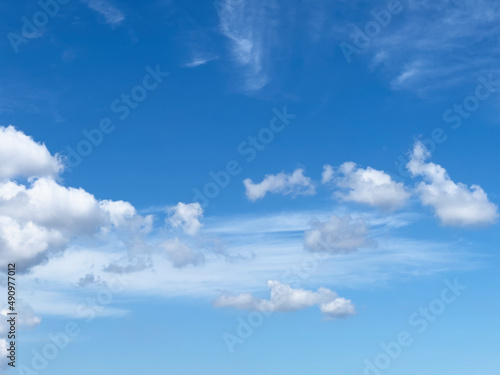 Natural blue sky with white puffy clouds in the afternoon
