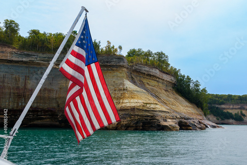 American Flag on a boat by the cliffs