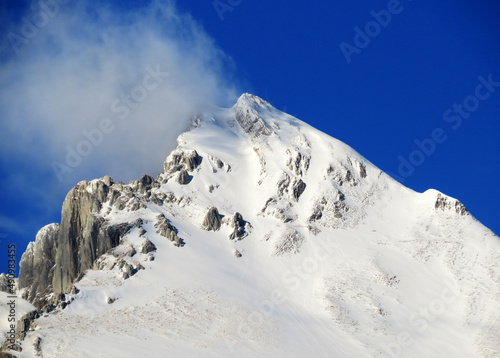 White blanket on alpine peak Wildhuser Schofberg (or Wildhuser Schafberg, 2373 m) in Alpstein mountain range and in Appenzell Alps massif, Unterwasser - Canton of St. Gallen, Switzerland (Schweiz) photo