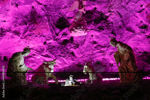 Holy Family sculpture at the Salt cathedral of Zipaquira illuminated in pink, Colombia