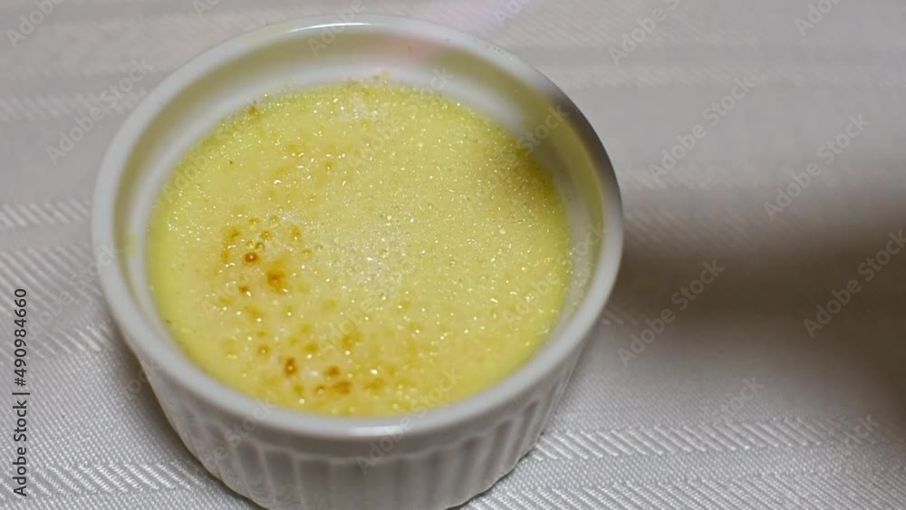 Caramelising sugar using a torch on creme brulee Caramelising sugar using a torch on creme brulee