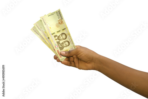 Fair hand holding 3D rendered 10000 Burundian franc notes isolated on white background photo